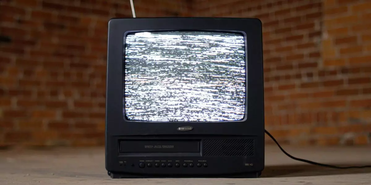 Old TV with static on the screen.